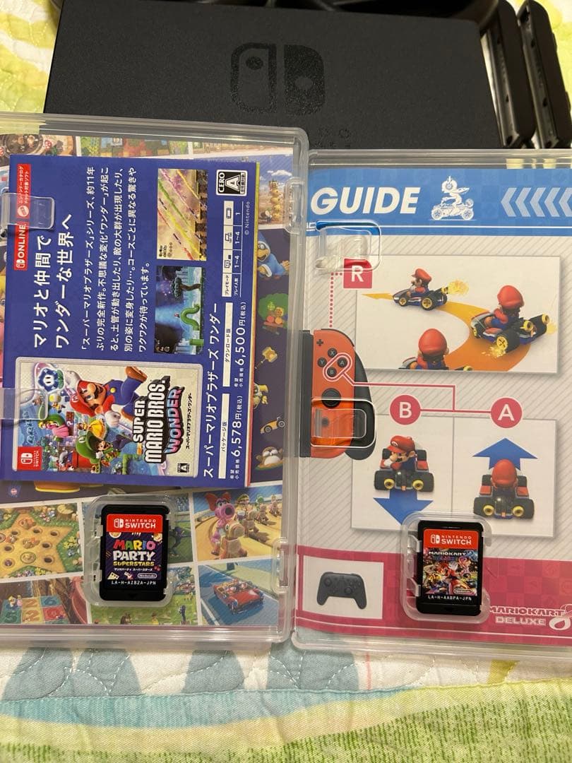 【値下げ】　Nintendo Switch + マリオソフト2本＋ハンドル2個付