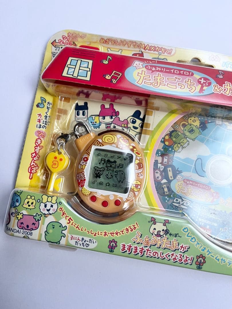 【新品未開封】たまごっち + たまDVD ふぁみりーイロイロ 希少　オレンジ