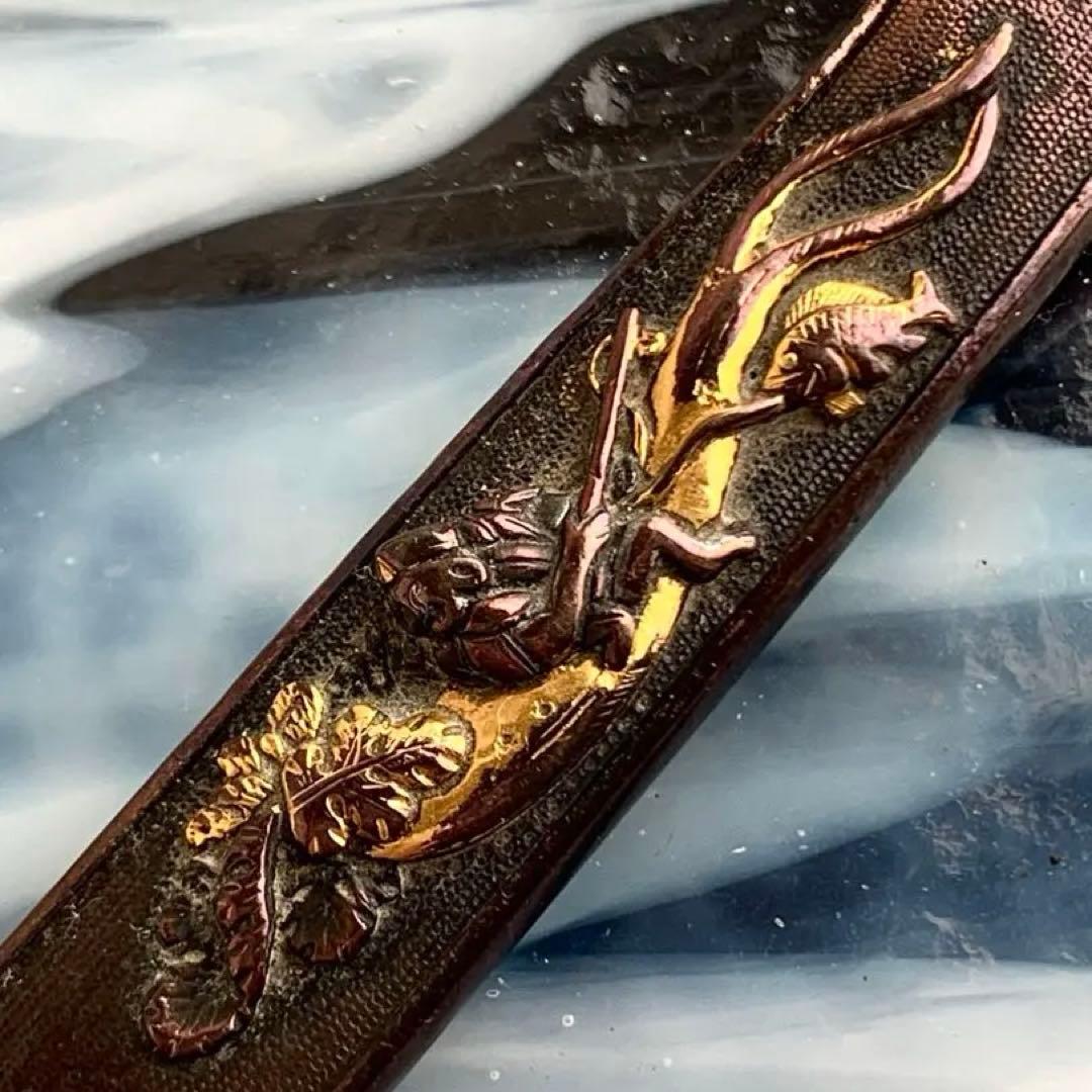 煙管　釣り人図彫刻