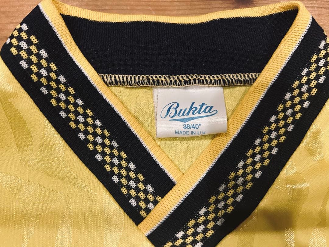ユニフォーム 古着 90s Bukta バクタ UK製 黄色 Vネック 40