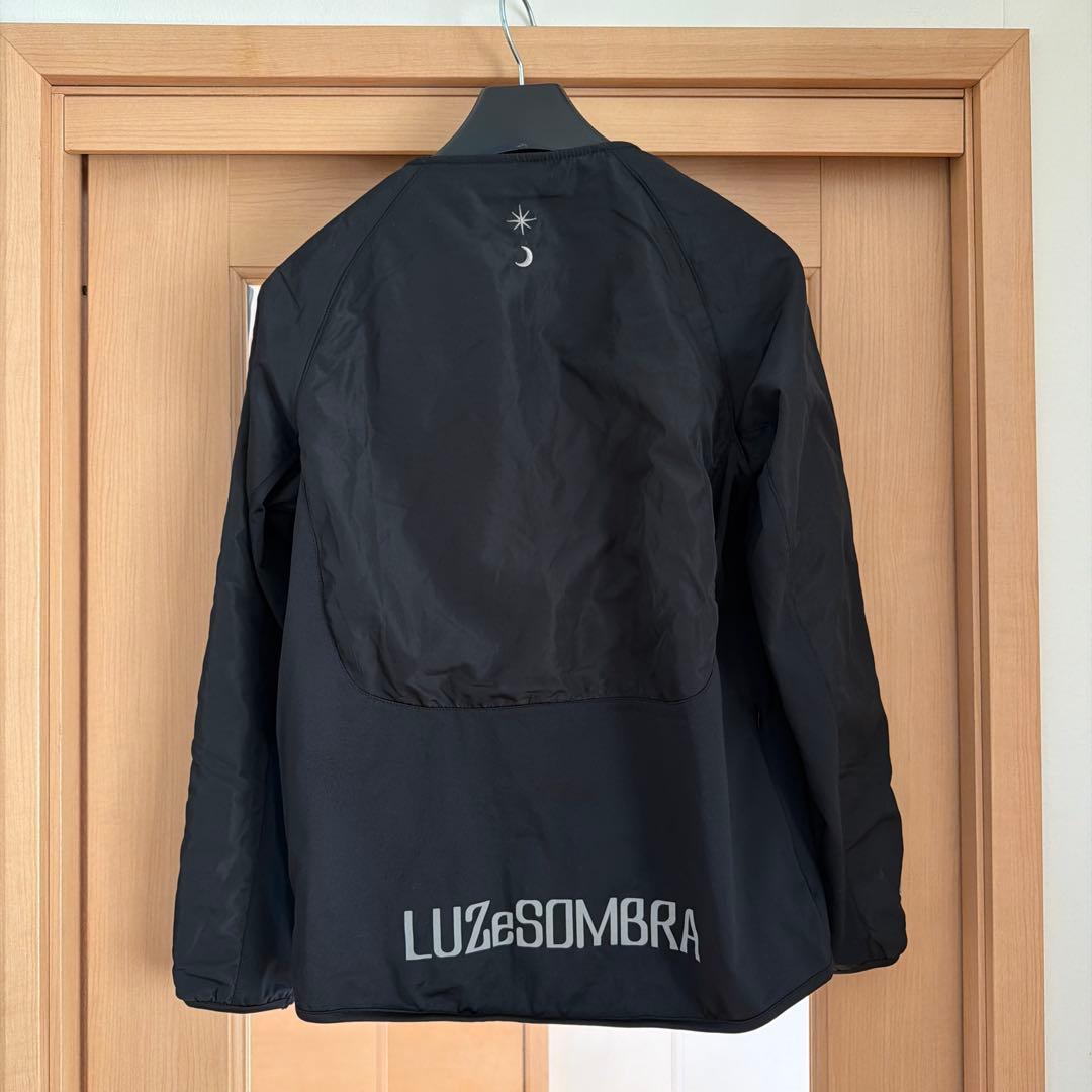 LS ブラックノーカラージャケット Luz Top Team