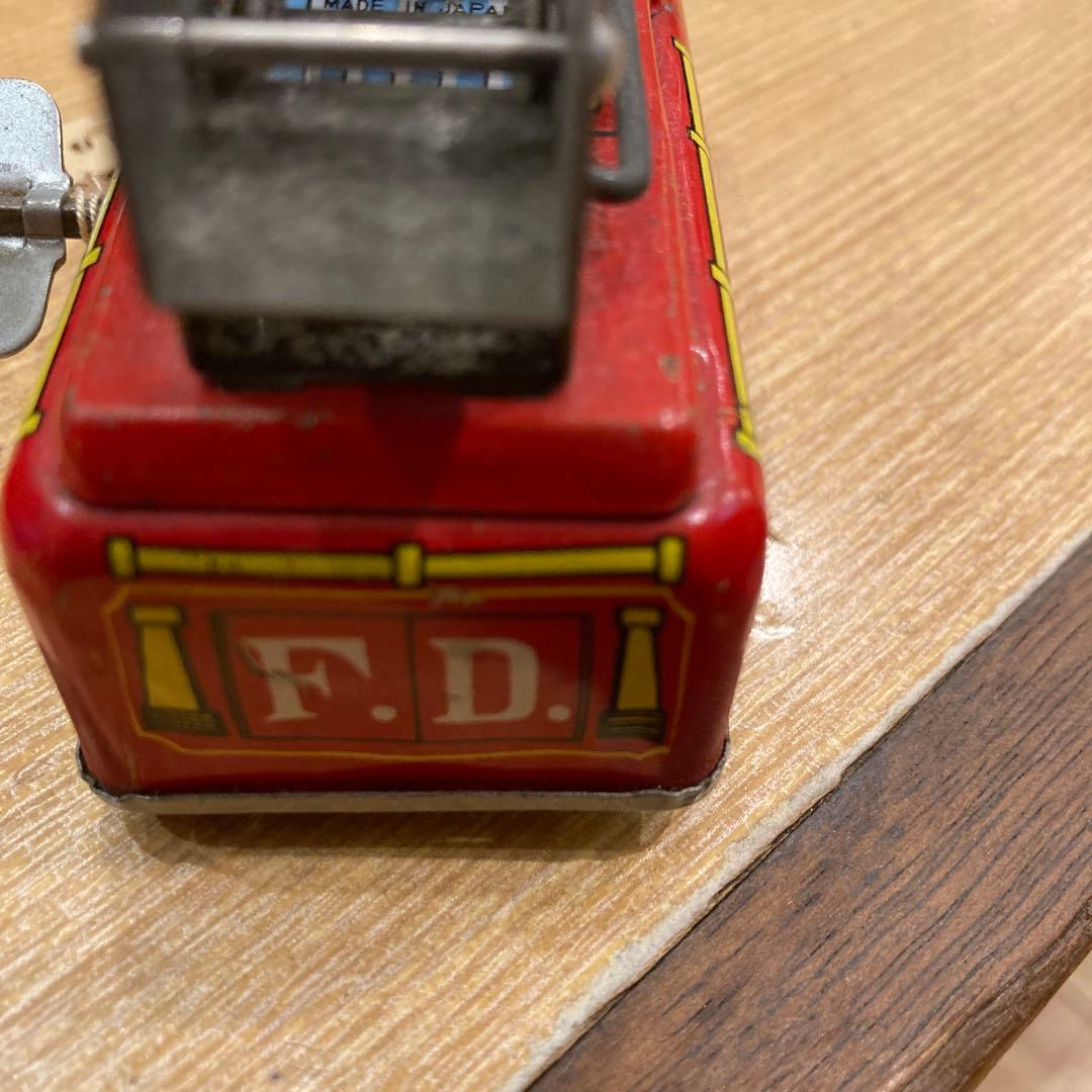 消防車 ミニカー 可動式はしご付き米澤製のゼンマイブリキ素材