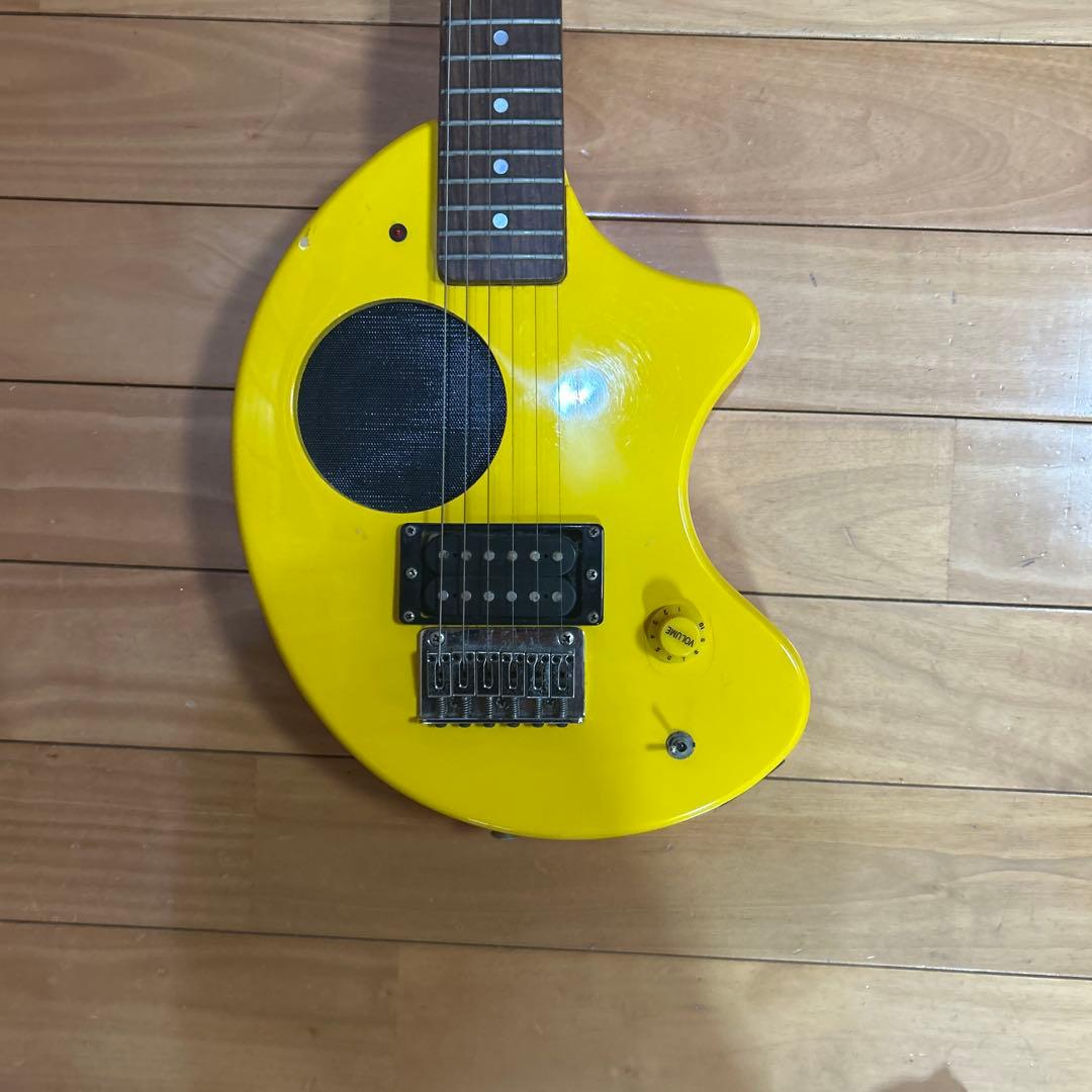 イエローエレキギター 丸型ボディ