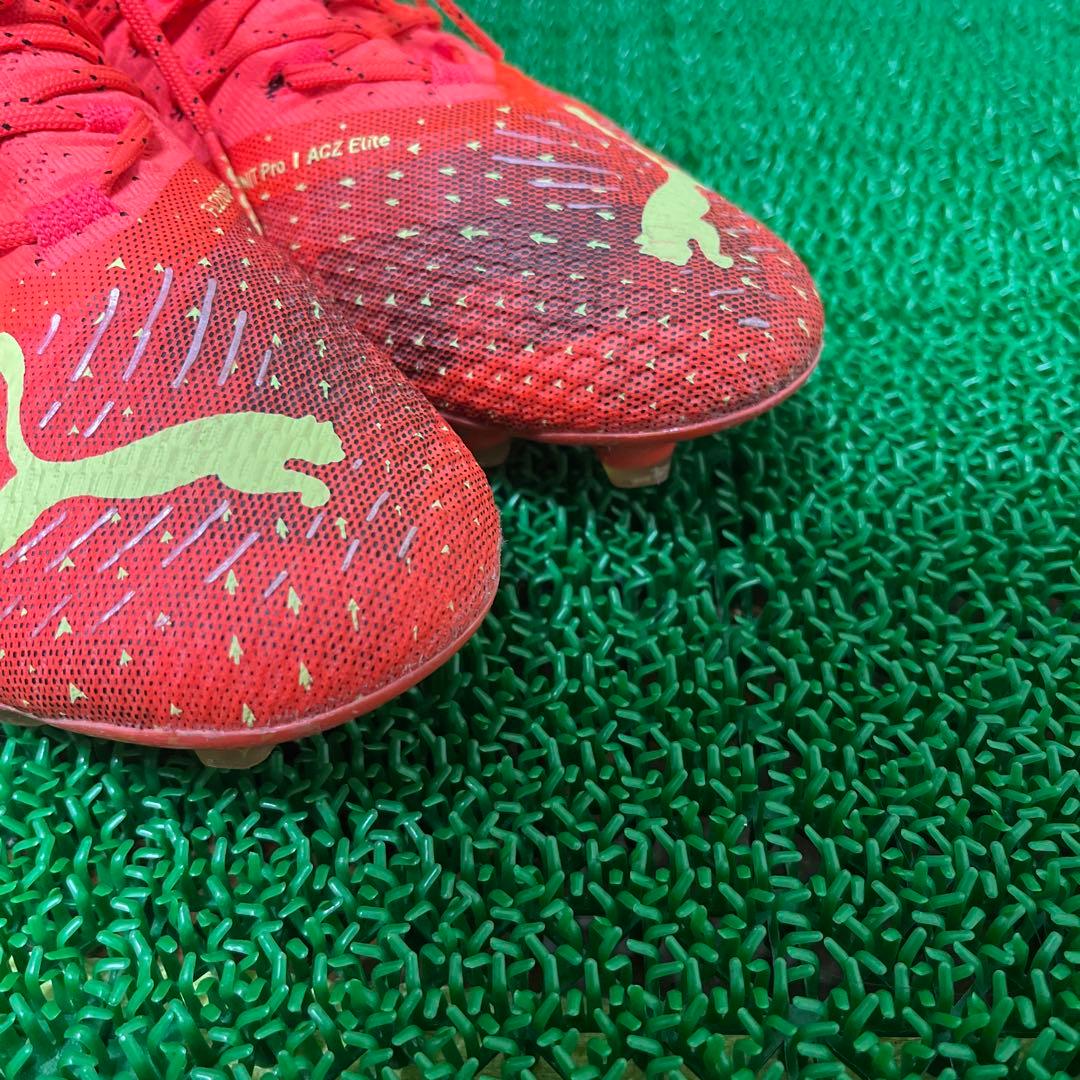 プーマ サッカースパイクフューチャーZ 1.4 HG/AG(オレンジ×イエロー)