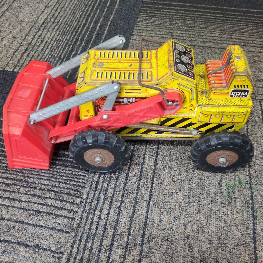 ブリキの 動くショベル付き建設車両